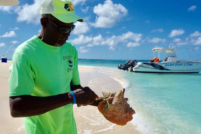 Gibbs Cay Stingray and Conch Dive Adventure - Watching the crew bring up live conch